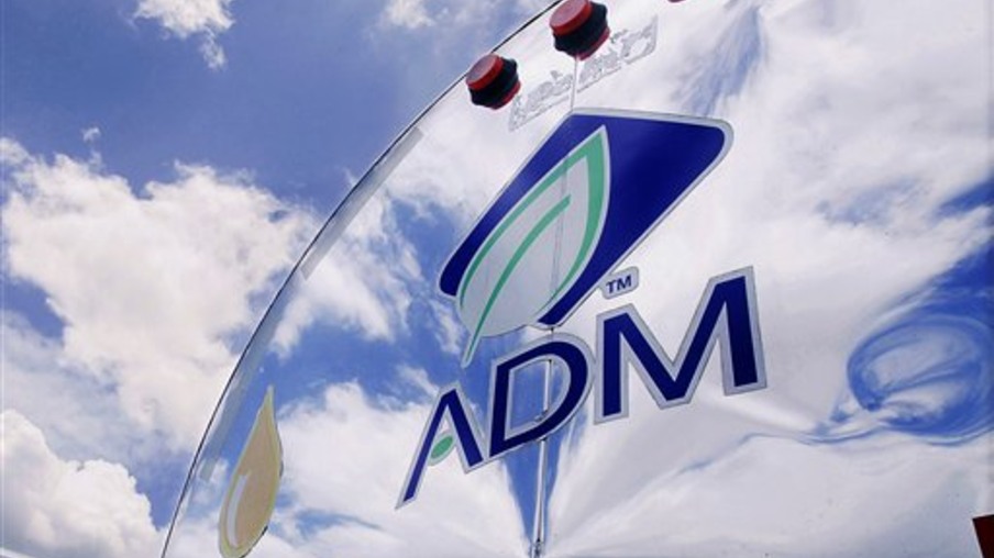 In this photo taken July, 2009, the ADM logo is seen on a tanker truck which carries mostly corn syrup at the Archer Daniels Midland Company plant in Decatur, Ill.  Agribusiness conglomerate Archer Daniels Midland Co. announced plans Wednesday, Jan. 11. 2012 to cut 1,000 jobs, or about 3 percent of its total workforce, with the majority of the positions being salaried staff.   (AP Photo/Seth Perlman)