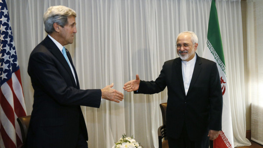 U.S. Secretary of State John Kerry, left, shakes hands with Iranian Foreign Minister Mohammad Javad Zarif before a meeting in Geneva, Switzerland Wednesday, Jan. 14, 2015. Zarif said on Wednesday that his meeting with Kerry was important to see if progress could be made in narrowing differences on his country's disputed nuclear program.  (AP Photo/Rick Wilking, Pool)