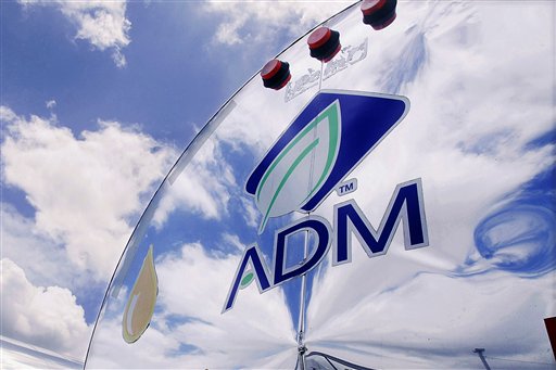 In this photo taken July, 2009, the ADM logo is seen on a tanker truck which carries mostly corn syrup at the Archer Daniels Midland Company plant in Decatur, Ill.  Agribusiness conglomerate Archer Daniels Midland Co. announced plans Wednesday, Jan. 11. 2012 to cut 1,000 jobs, or about 3 percent of its total workforce, with the majority of the positions being salaried staff.   (AP Photo/Seth Perlman)
